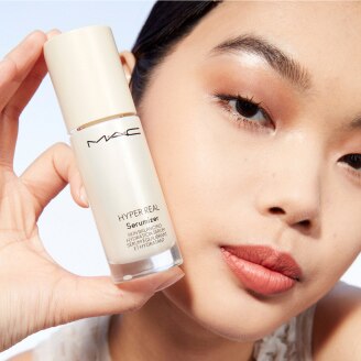 Model with MAC Cosmetics product.